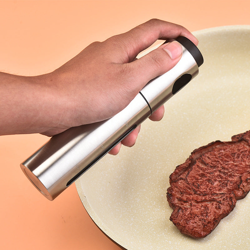 stainless steel oil sprayer bottle in use lifestyle