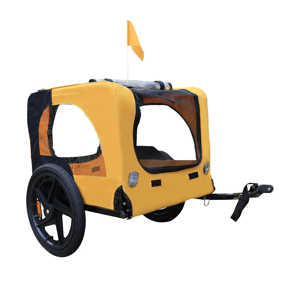Dog bike trailer attached to bicycle on outdoor ride